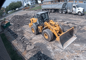 Bulldozer and cleared parking lot. 