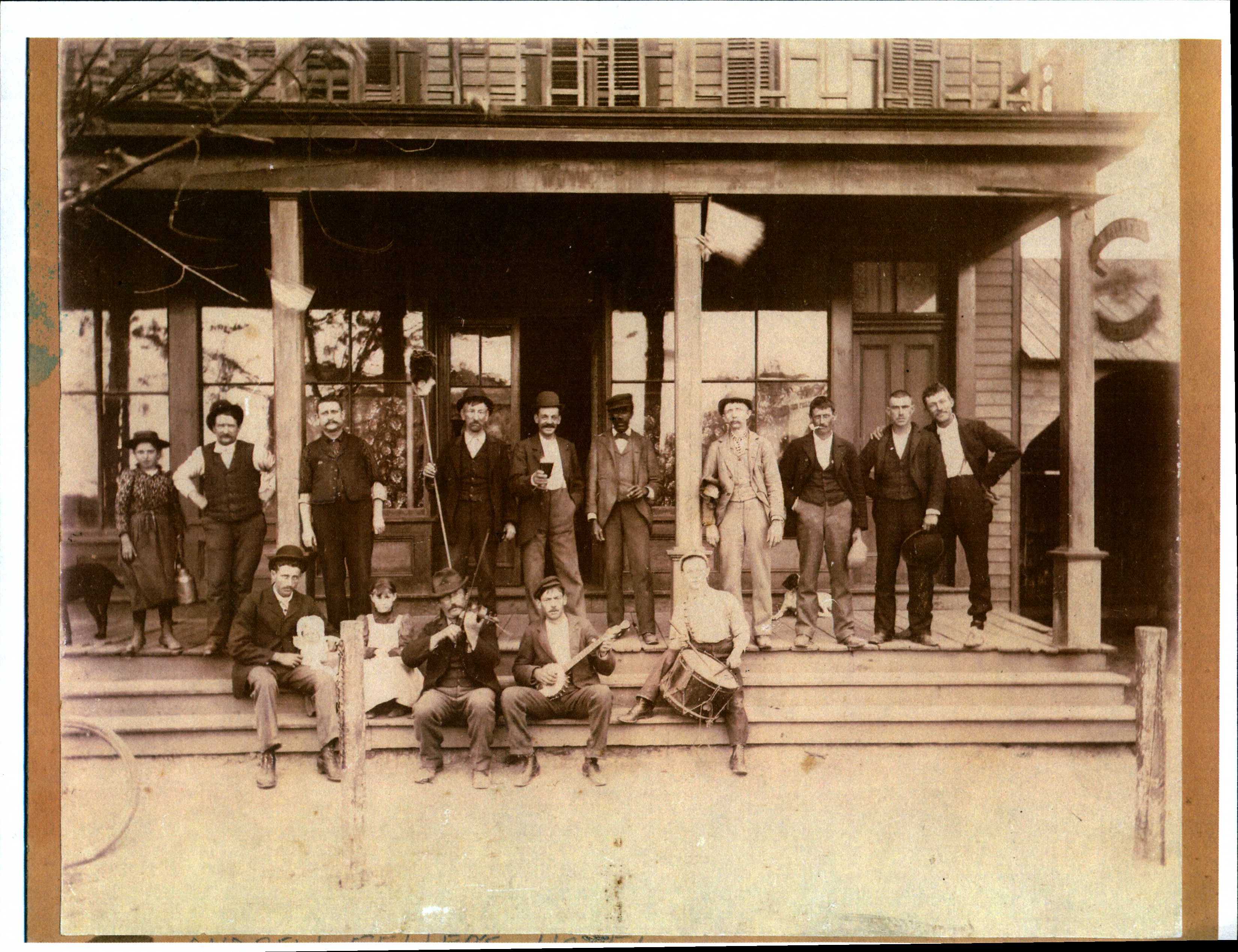 Black and white 19th century photo of group of men. 