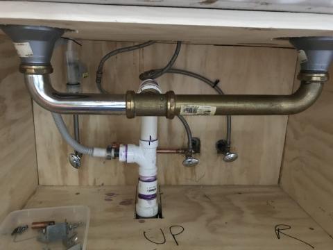 Under the sink pipes